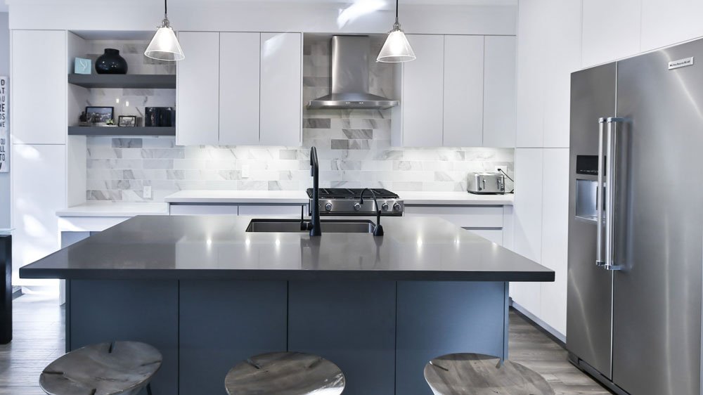 Sleek, modern kitchen with a large KitchenAid refrigerator